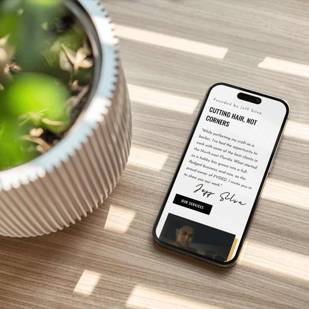 Modern barber studio web design with sleek interface, showcasing haircut services and booking options on a digital platform.
