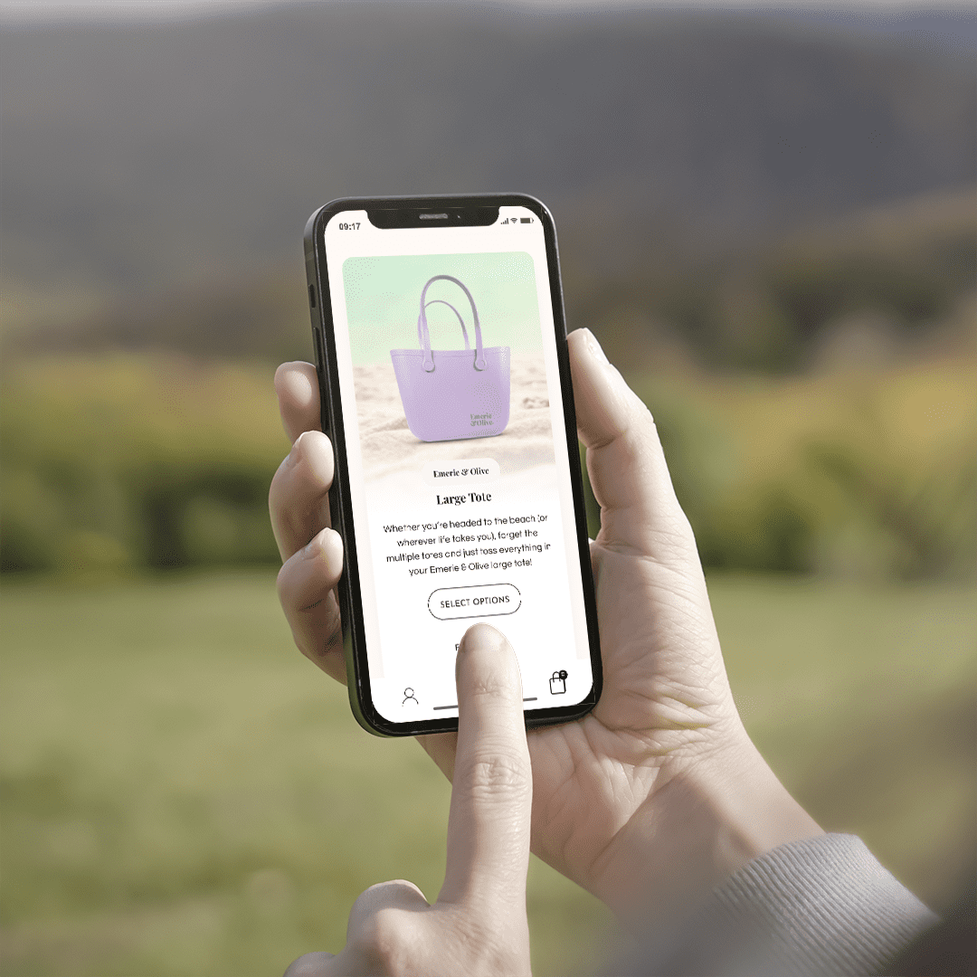 iPhone mockup displaying an autumn scene, surrounded by sustainable beach bags on a wooden surface.