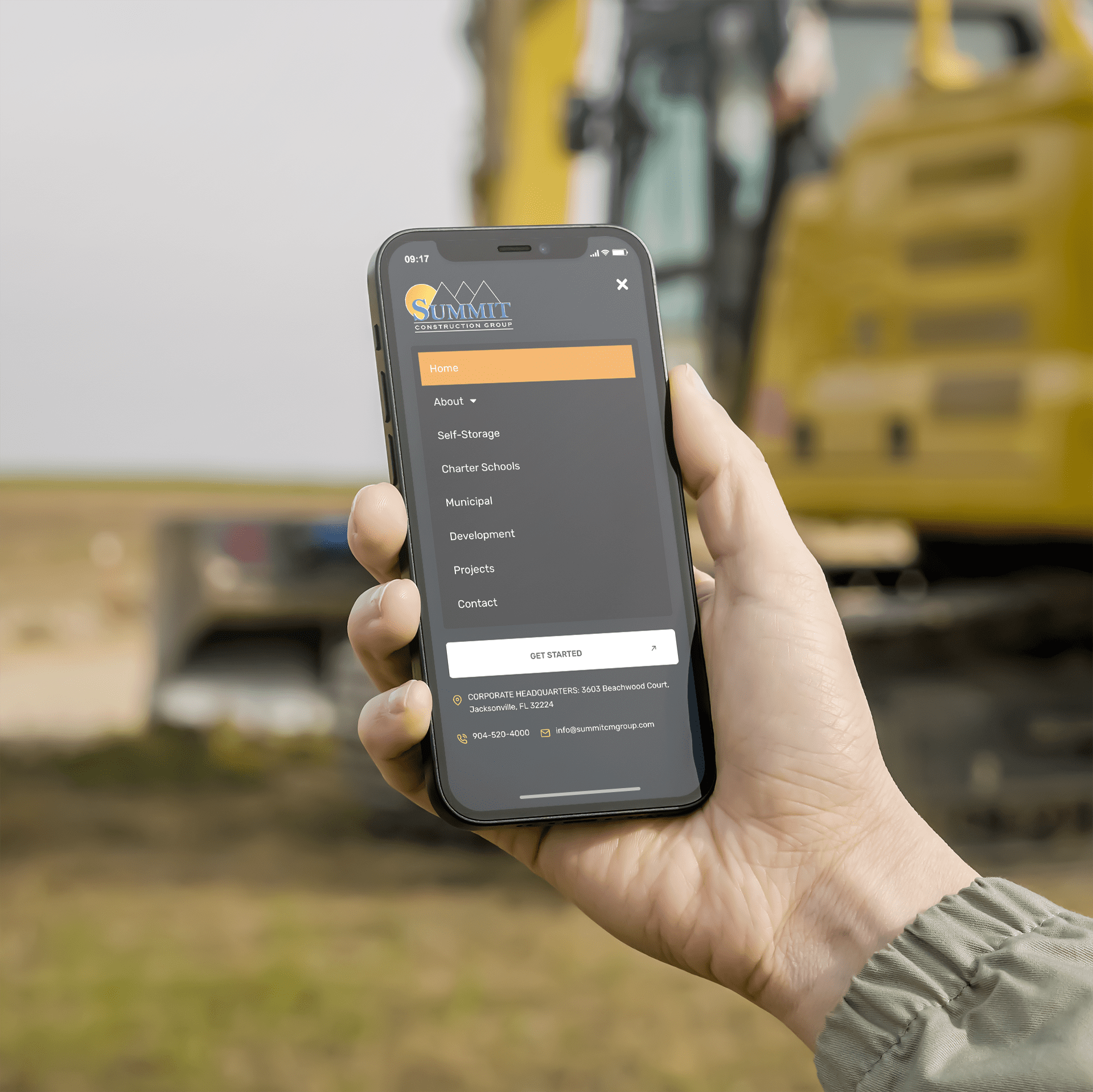 iPhone displaying a construction scene, relevant to commercial development projects, with cranes and buildings in progress.