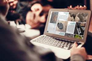 Mockup of a Finger Lakes winery website displayed on a laptop screen, showcasing elegant design elements and vineyard imagery